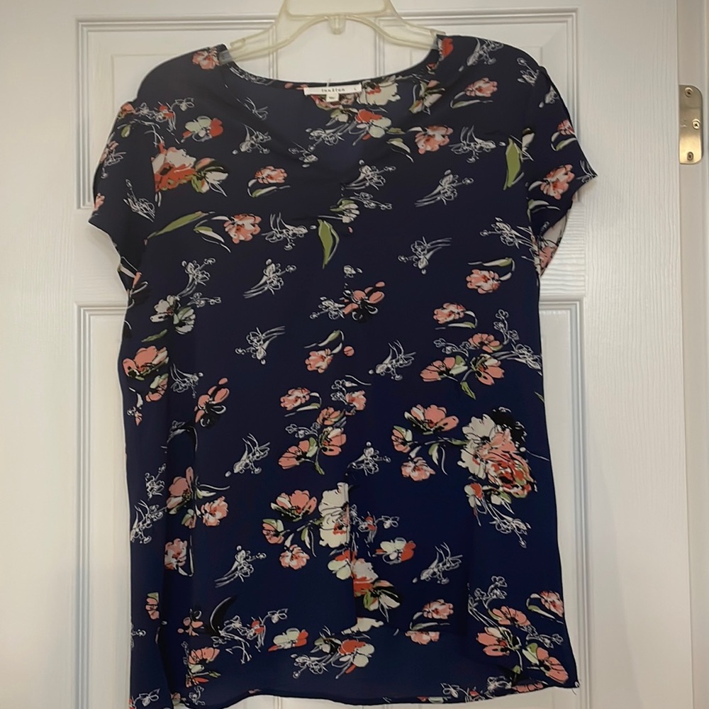 Spring blouse with fake buttons down the front and flattering sleeves